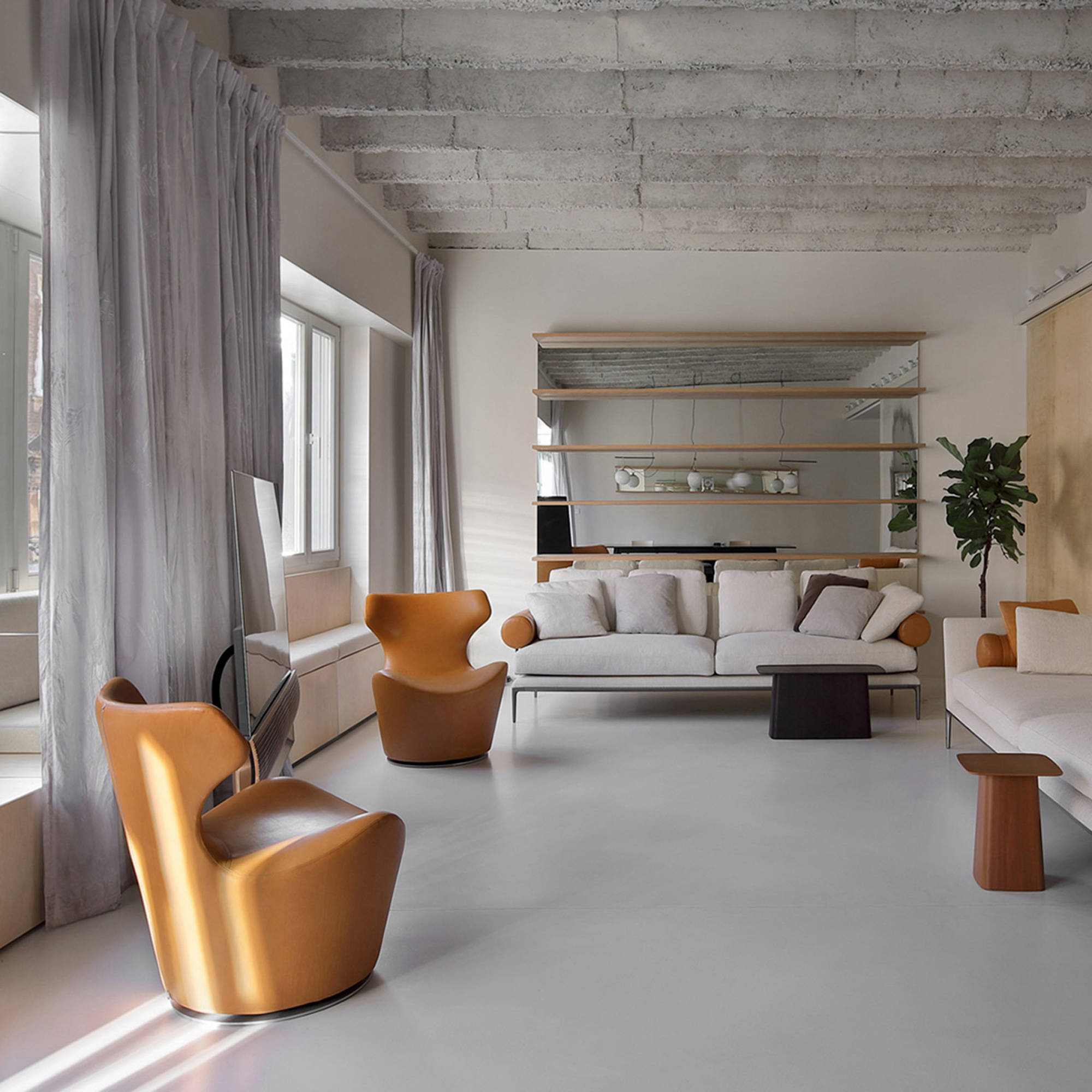 Cohesive floor and wall surfaces in a loft living area