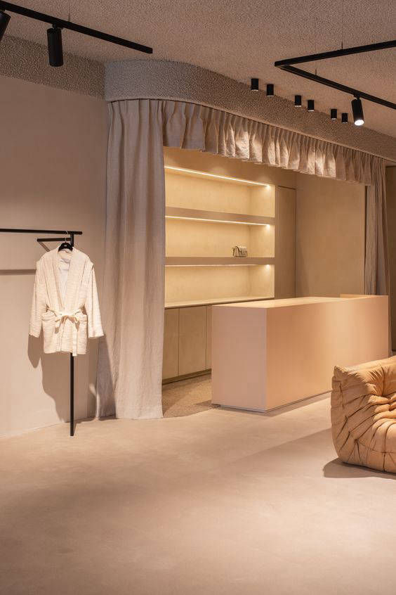Simple reception desk on light-coloured retail flooring