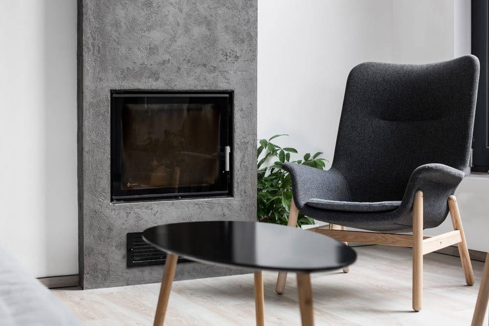 Cementare fireplace and decorative wall detail