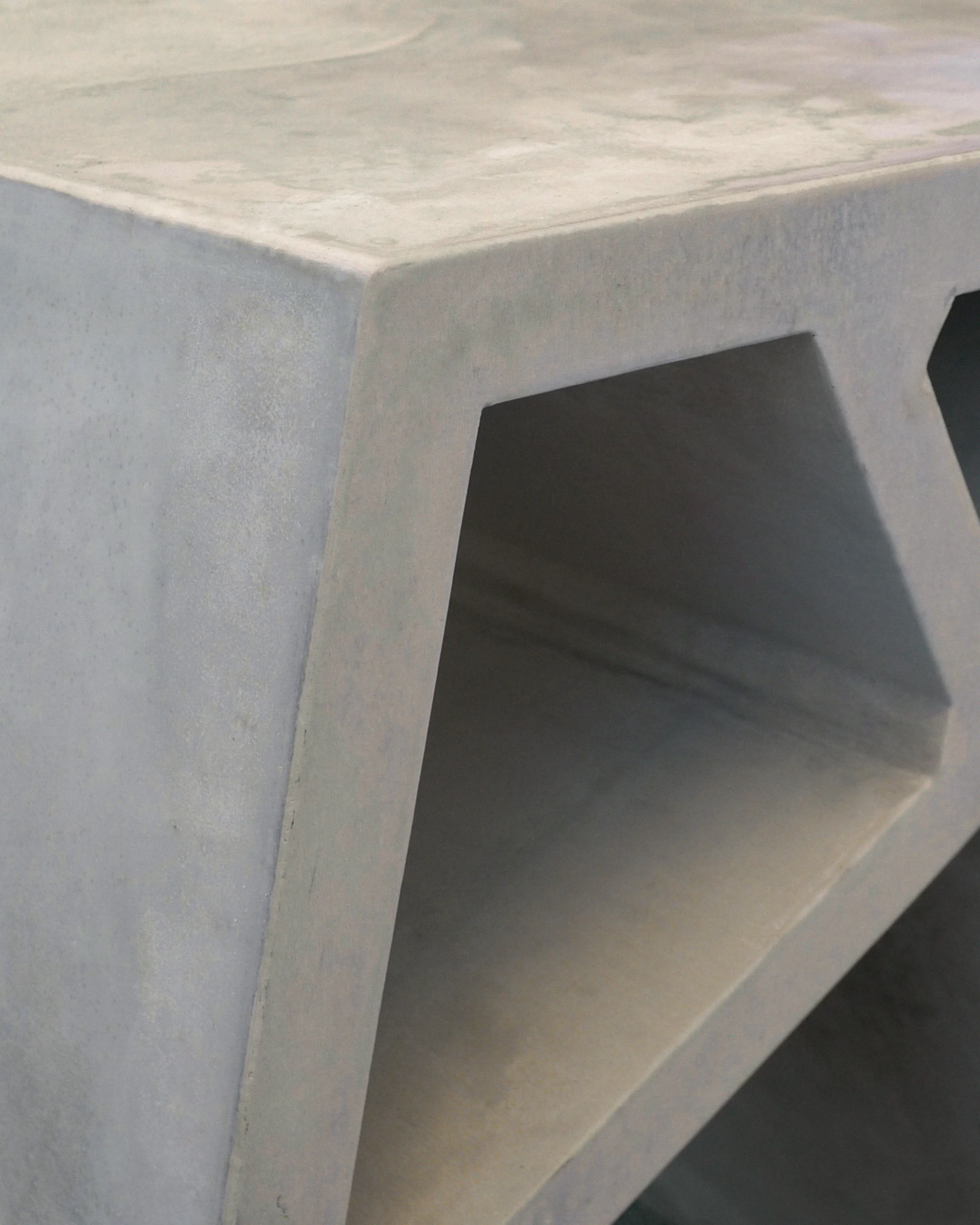 Thick edge and open shelf detail of grey furniture