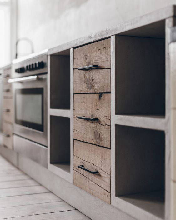 Grey kitchen worktop and cabinet surround with timber drawers