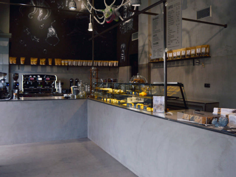 Grey service counter integrated with a glass display case